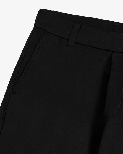 The Proper Pant Relaxed Straight Fit in black — close-up of the waistband and side pocket