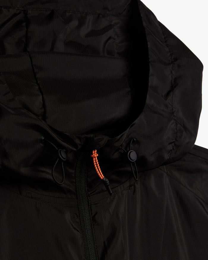 A close-up shot of the hood and neckline of The Running Jacket in black, highlighting the black drawstrings, YKK zipper, and the contrast orange zipper puller.