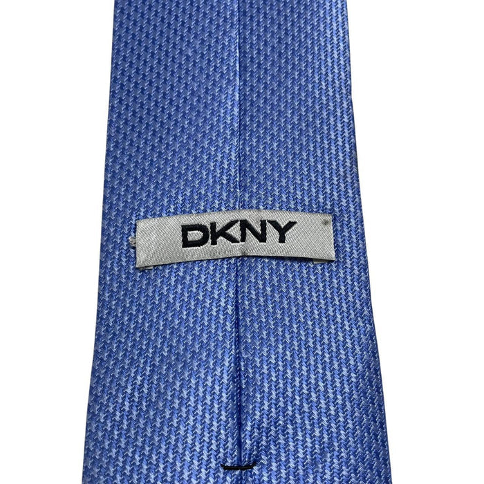 DKNY blue silk tie with subtle sheen and classic design.