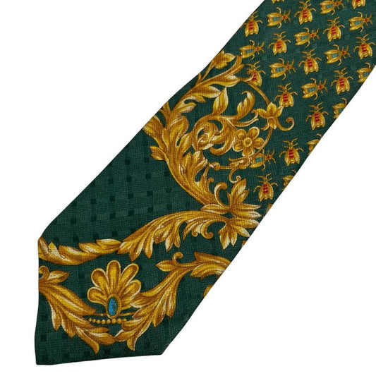 Versace silk tie green and gold baroque print with intricate design details.